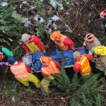 Rescuers carry the victim uphill to the highway.