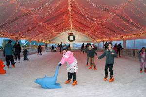 Skaters make their way around the rink of the Port Angeles Ice Village in November 2019. (Keith Thorpe/Peninsula Daily News)