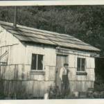 C. Edward Cone outside his cabin near Mora, WA, in the 1930s. Olson Family photo