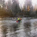 The Swift Water Rescue team practices pulling a person out of the river.