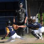 Forks runner Noah Foster (1) was tagged out at home by Beaver catcher Walker Wheeler. Umpiring is Carl Windle. Photo by Lonnie Archibald