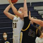 Chole Leverington (21) takes a shot over Chief Leschi defenders.