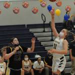 Kesia Rowley (11) puts up a shot in the key.