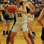 Kray Horton (12) looks to pass. Photos by Lonnie Archibald