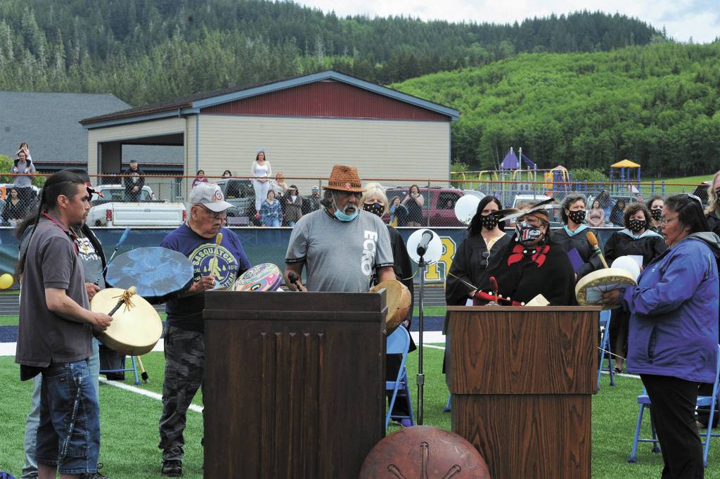 Quileute Tribal members honored the graduates with a song. More photos on page 10.