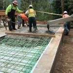 Placing the concrete for the approach slabs at the Canyon Creek bridge.