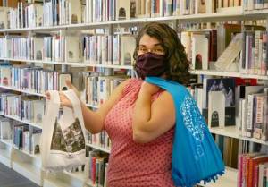 Librarian Sarah Morrison displays upcycled T-shirt bags. Submitted Photo