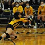 Spartan Morgan Rule hits in front of the Spartan bench. Photos by Lonnie Archibald