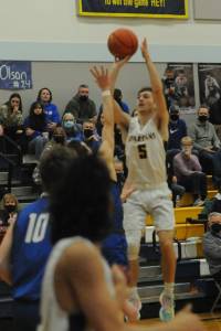 Spartan senior Ashton Doyle puts up a shot over Toutle Lake in this play-off contest won by Forks 71 to 66. Photo by Lonnie Archibald