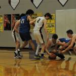 On the defense for Forks on the floor is Spartan senior Logan Olson. Other Spartans from left are Aidan Salazar, Landin Davis, Keaton Northcutt, and senior Riley Pursley. Forks defeated Toutle Lake 71 to 66 to advance in district play. Photo by Lonnie Archibald
