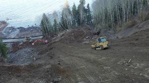 This photo from Feb. 12 shows crews making great progress clearing SR 112 at Clallam Bay. Further east, construction to begin clearing the second slide at Jim Creek is expected to begin in early March. WSDOT Photo