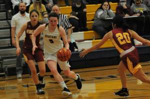 Spartan Keira Johnson drives against Winlock in an earlier game played in Forks in which the Spartans defeated the Cardinals in District 4 play. The Forks girls went on to defeat Ilwaco in Rochester 67 to 36. In that game, Johnson scored 27 points. Forks was to face Rainier in Castle Rock on Tuesday, Feb. 15 after the press deadline for the Forks Forum. Photo by Lonnie Archibald