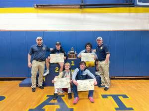 Regionals champs Individual photo from left to right: Coach Frishkorn, Conner Demorest, Sloan Tumaua, Coach Weakley (sitting) Jake Weakley, Hayden Queen.
