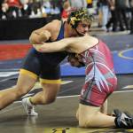 Above right: Sloan Tumaua (left) at 220 lbs came in 4th at state.