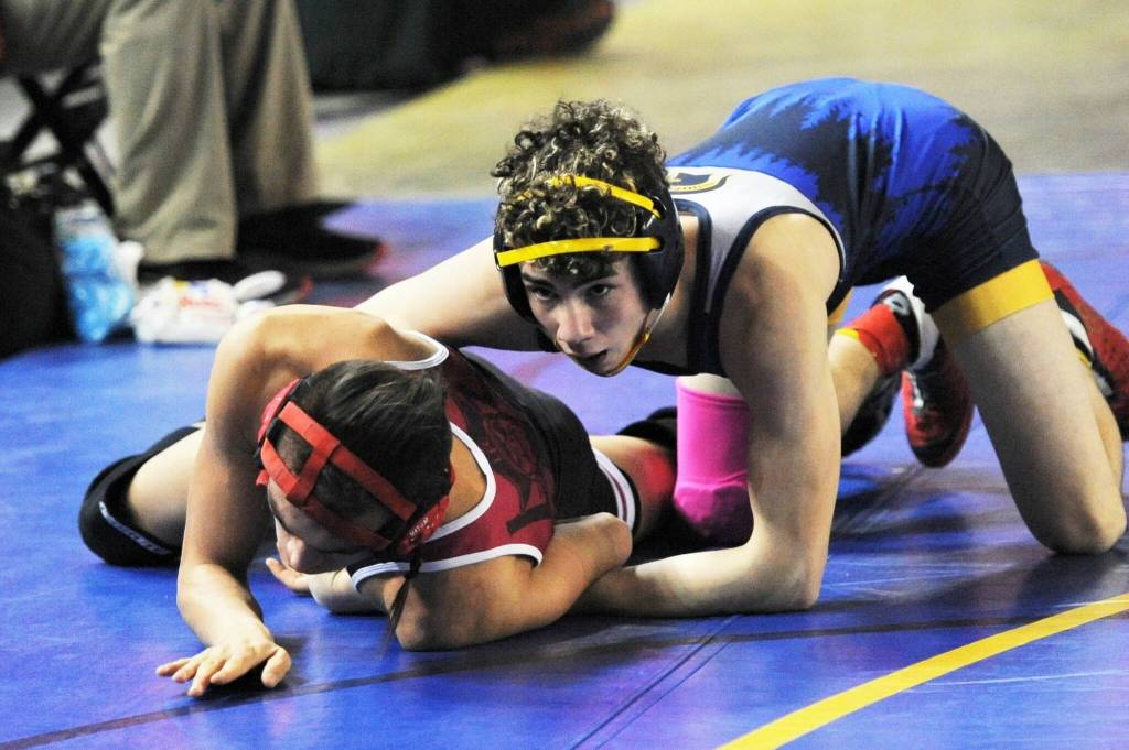 Forks Walker Rondeau (top) competed in the 132 lb bracket.
