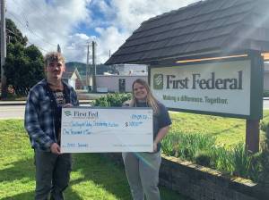 Seen here with the big check are the 2022 student auction coordinators Hayden Queen and Nicole Winger. Submitted Photo