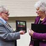 Outgoing PER Lynne Barnes presents Pat Kain with the Elk of the Year Award.