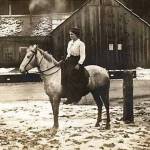 Mary Schutz Clark on her horse about where the front of the Rainforest Arts Center is today.