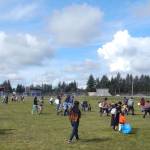 Egg hunting got underway under sunny skies at Tillicum Park at 11 a.m. sharp as Forks Police Chief Mike Rowley gave everyone the Go over his vehicles PA system. Only a few hours later and these egg hunters would have been hunting in the snow, hail, and rain. Photo Christi Baron