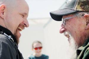JIM BOLIN of Tecumseh, right, and his grandson, Chris Bolin of Alaska enjoyed their skydiving experience in celebration of Jims 90th birthday. Chris daughter Ari is in the background. Ann Wickett/Chieftain