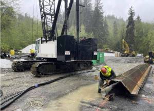 ICI subcontractor preparing equipment for temporary sheet pile shoring.