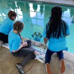 Students watch as their ROV enters the water at the Forks Athletic and Aquatic Center (FAAC). Submitted photos