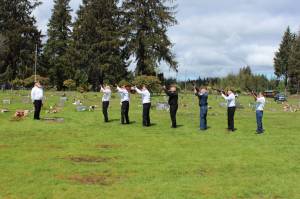 Members of American Legion Post 106 offer a 21 gun salute at the Forks Cemetery on Monday. Photos Christi Baron