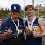 Sloan Tumaua and Ashton Doyle give a thumbs-up and show off their medals.