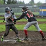 Scrap Yard Dawgs third baseman Pearl Salazar tags Bandits runner Sarah Sifuentes out at third. Scrap Yard won the Kenny Church softball championship by defeating the Bandits. Photo by Lonnie Archibald