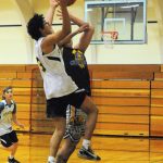 Spartan Brandon Galeana scores over Logger defenders.