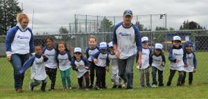 The Mariners leave the practice field en route to the stadium where they anticipated another victory. Photo by Lonnie Archibald