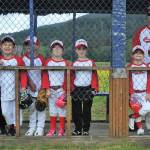 The Red Sox awaited quietly in the dugout watching for the rain which never came. Yes, that is correct, no rain. Photo by Lonnie Archibald