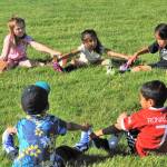 The Black Bears in the 4 to 6 age group were serious about their calisthenics prior to practice. Photo by Lonnie Archibald