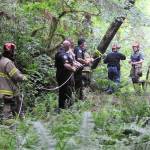 Forks law enforcement, medics, and fire department personnel along with swift water rescue work to rescue a woman and her dog from the banks of the Sol Duc River at a campground just off Pavel Road near the Sol Duc Hatchery. Photo by Lonnie Archibald