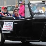 Barry and Diane Krieg, of Vancouver, WA, were this years Tourists of the Day. After being showered with gifts provided by our generous local businesses they were showered upon by a bit of rain as they rode in the Grand Parade on Monday. Being Washingtonians they didnt seem to mind. They were driven in the parade by Judge Bruce Hanify. The Forks Chamber of Commerce coordinates the Tourist of the Day activities each 4th.