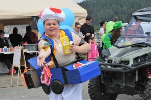 One of the best parts of the Quileute Days Parade… Candy! Here Annie Foster with the Quileute Tribal office entry doesnt disappoint. Photo by Lonnie Archibald