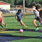 Lots of soccer action on the Spartan turf. Photo by Lonnie Archibald.