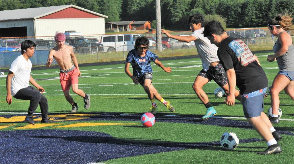 Lots of soccer action on the Spartan turf. Photo by Lonnie Archibald.