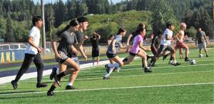 Even with the temperatures still in the 80s Forks High School soccer players were off and running at Spartan Stadium on the evening of July 28. Photo by Lonnie Archibald