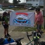 Sainato and Forks American legion Post Commander Bubba Bolin with a Quileute flag that was presented to Sainato.
