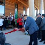 Quileute Tribal Council Chairman Douglas Woodruff Jr. prepares to cut the ribbon at the Quileute Tribal School Blessing Ceremony held last Friday morning at La Push. Looking on from behind are council members Rio Jaime, Tony Foster, and Skyler Foster. Council member Zachary Jones was not available. Photos by Christi Baron
