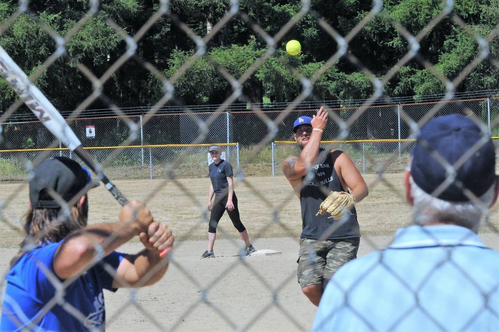As seen from the bleachers Team Gramps pitcher Cameron LeDuke delivers to this Hanger batter in the championship game won by the Hanger on Sunday afternoon at Tillicum Park.