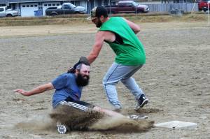 Dayne Brown of Team Gramps was called safe at third as Mossquatch third baseman David Hurn made the tag. Gramps took this contest 21 to 11.