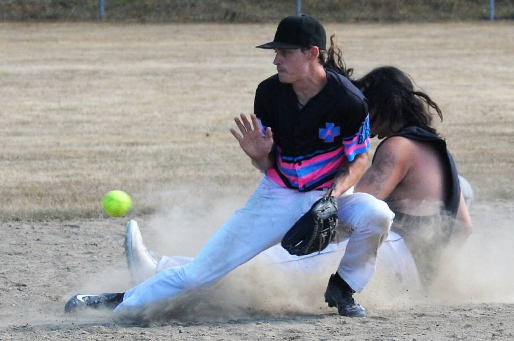 Hit For Brains runner Conner Ferro-May slides safely into second covered by Elandon Washburn of the Master Batters. Master Batters took this one 6 to 3.