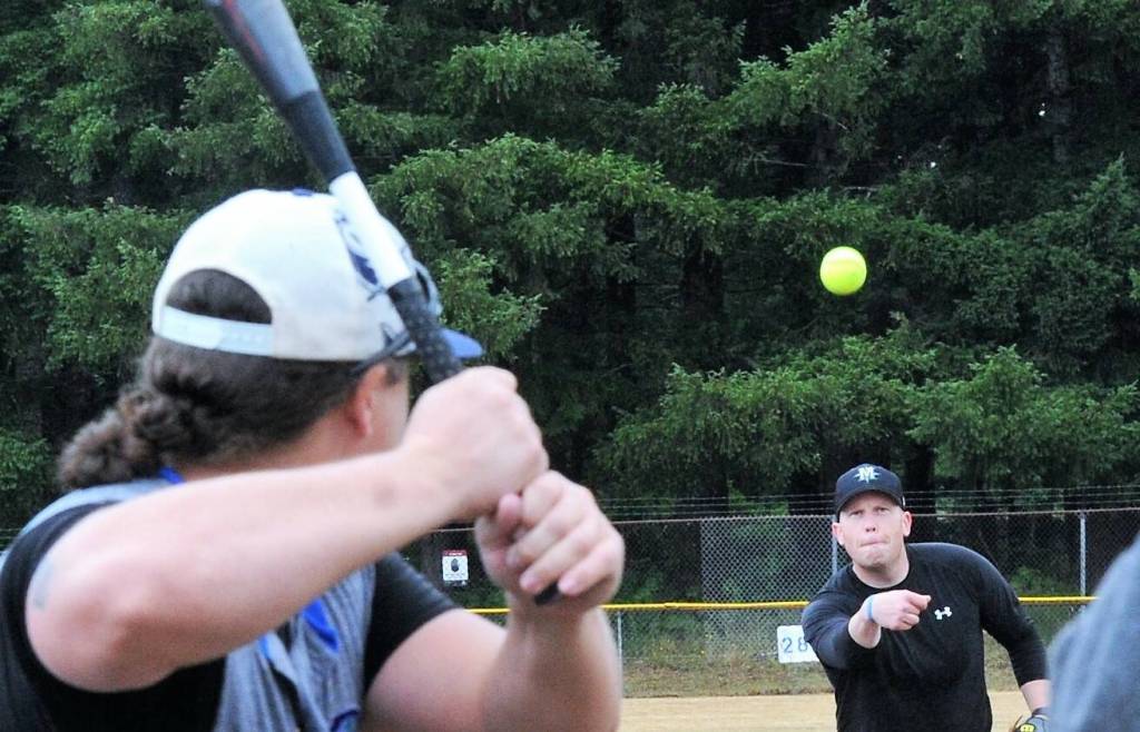Rick Gooding playing for Mossquatch Resort pitches against the Forks Merchants who squeaked by Mossquatch 18 to 17 in extra innings Saturday. Photos by Lonnie Archibald