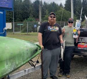 Jacob Hoschar, seen here with his dad, Andrew, and holding his 2nd prize winnings, took part in the kids category of the Lake Quinault Fishing Derby on Saturday at Lake Quinault. Prior to going, he sought sponsorship and a few supplies from local businesses. Assisting him in getting what gear he needed for the derby were Forks Outfitters, Decker City Hardware, and Jerrys. Submitted Photo