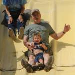 Susie, Kevin, and Grandson Terrance Hinchen on the Super Slide at the Clallam County Fair on Friday.