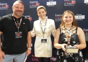 A dad and daughter with Maggie Grace. This dad said what made him happy was the smile on his daughters face. Photos Christi Baron