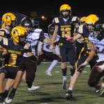 Forks Camryn Kennedy (8) looks for running room Friday night in Forks against the Ravens. Also in on the action are Gunner Rogers (16) Ryan Rancourt (13) and Landen Olson (10). Photo by Lonnie Archibald