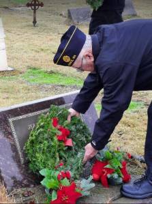 The Wreaths Across America event is part of a national initiative to honor veterans of military service. Ceremonies took place at six cemeteries across the North Olympic Peninsula over the weekend. More than 2,400 wreaths were placed overall with 171 wreaths placed at the Forks Cemetery on Saturday afternoon.
It was asked when a wreath is placed on the grave, to say the veterans name aloud and thank them for their service. If appropriate, salute. Here Ray Winney, of American Legion Post 106, places a wreath on the grave of veteran Jerry Huggins. Photos Janet Hughes